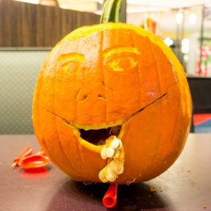 Pumpkin Carving - A Face (Not sure about the seeds)!